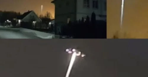A glowing UFO beam pierced the strange orange sky over Stockholm—prompting whispers that alien crafts are charging through hidden portals above.