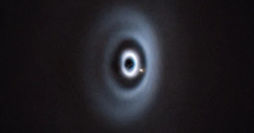 Shocking image from ESO: A young sun and its giant offspring 'tearing through' space to be born.