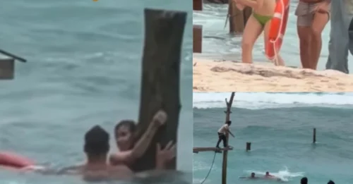 Imágenes extraordinarias muestran a un hombre arriesgando su vida en un acto de valentía en cuestión de segundos para salvar a una mujer de ahogarse, después de verla aferrada desesperadamente a un poste de madera en una playa de Bali — un rescate que paralizó el corazón y dejó a los testigos en estado de shock.