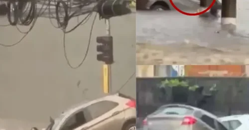 DILUVIO INFERNAL: Aterrador momento en que una mujer se aferra a un poste de luz para salvar su vida durante una rápida inundación mientras su auto es arrastrado durante una brutal tormenta.