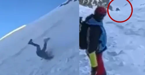 RESBALÓN DEL ESCALADOR: Momento aterrador: un montañero resbala y se precipita sin control por una montaña nevada mientras los espectadores gritan aterrorizados.
