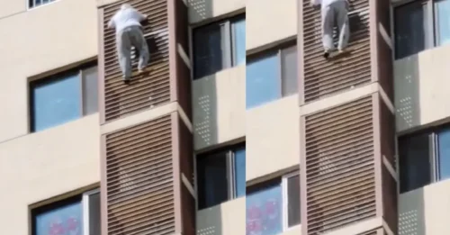 ¡AFÉRRATE! Momento de horror: una anciana se aferra a la pared de un rascacielos a 49 metros de altura tras salir por la ventana del piso 27.